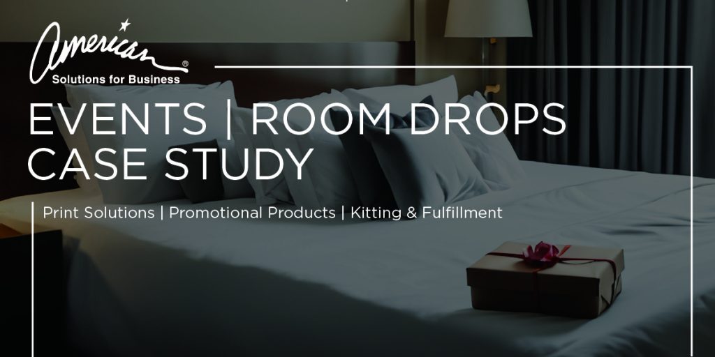 A neatly made bed in a dimly lit room, with a small wrapped gift box placed on it. Text overlay includes 